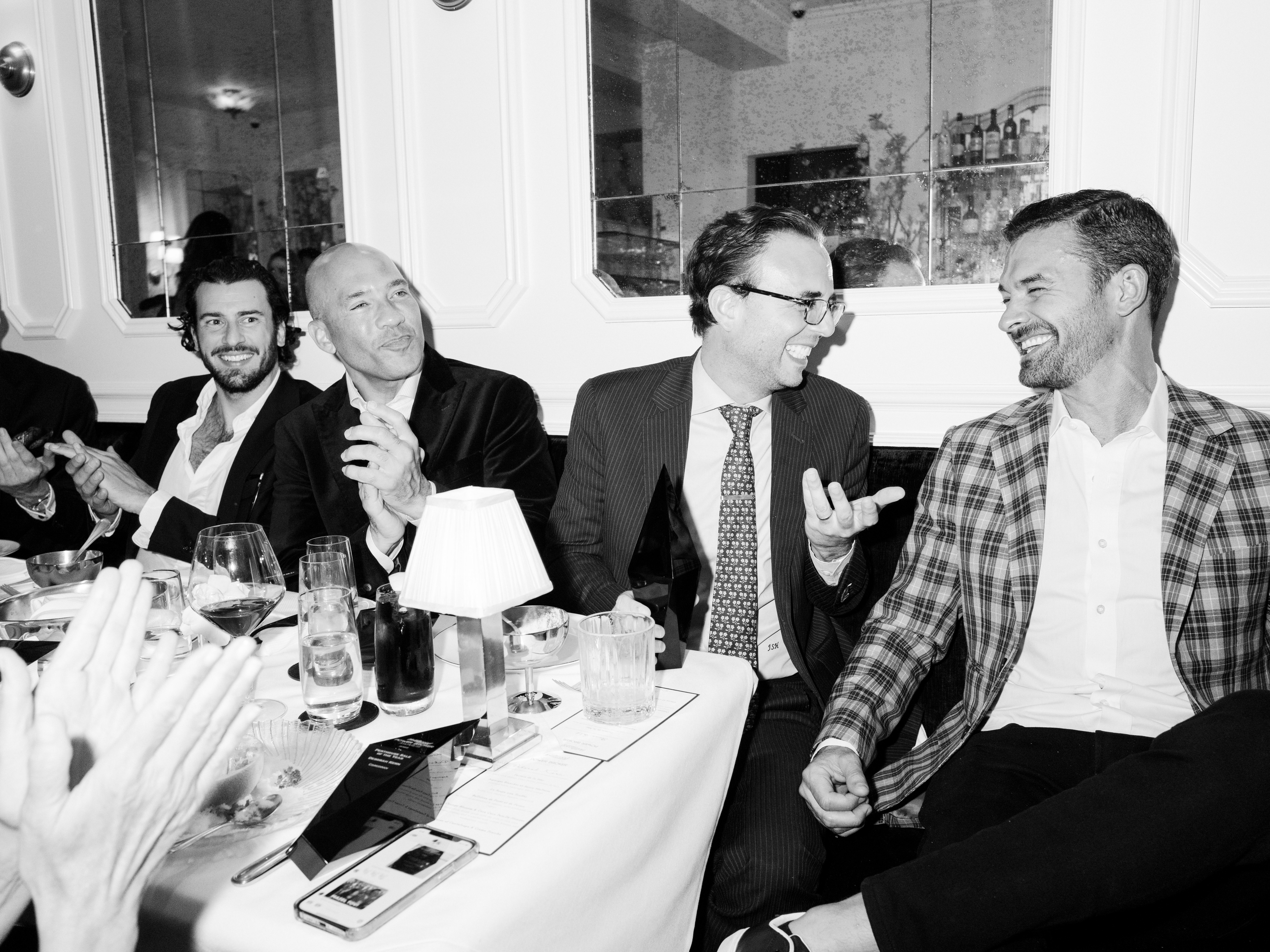 Guests at The Hollywood Reporter Power Broker Awards step-and-repeat presented by The SOCIETY Group.